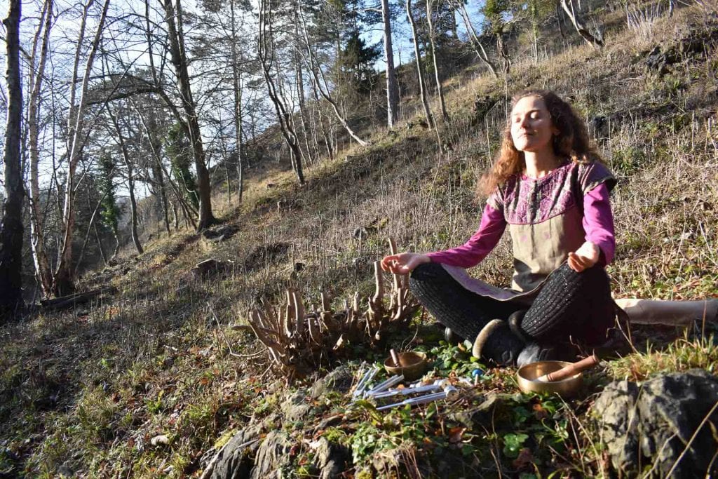 Belen Prado from Enchanted Flute meditating outdoors