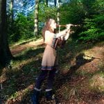 Belen Prado from Enchanted Flute playing the flute outdoors-6